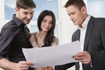 couple is considering the future design of the apartment with a designer